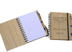 Wooden notebook with pen and personalized text on a white background