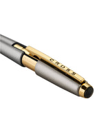 Pen with gold and black accents on a white background