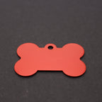 Red bone-shaped tag on a black background