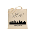 Beige tote bag with black 'SXSW' and 'Austin, Texas 2026' text on a white background